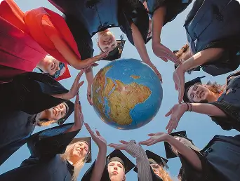 Students forming hands around a globe